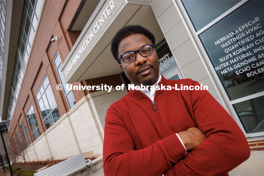 Charles Chioma Nwaizu, Assistant Professor of Practice in Food Science and Technology, is photographed outside the Food Innovation Center on Nebraska Innovation Campus. March 21, 2023. Photo by Craig Chandler / University Communication.